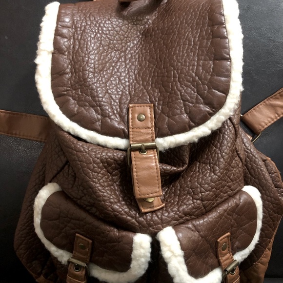 Claire’s Brown Faux Leather Backpack with Fluffy White Trim Buckles - Picture 1 of 2